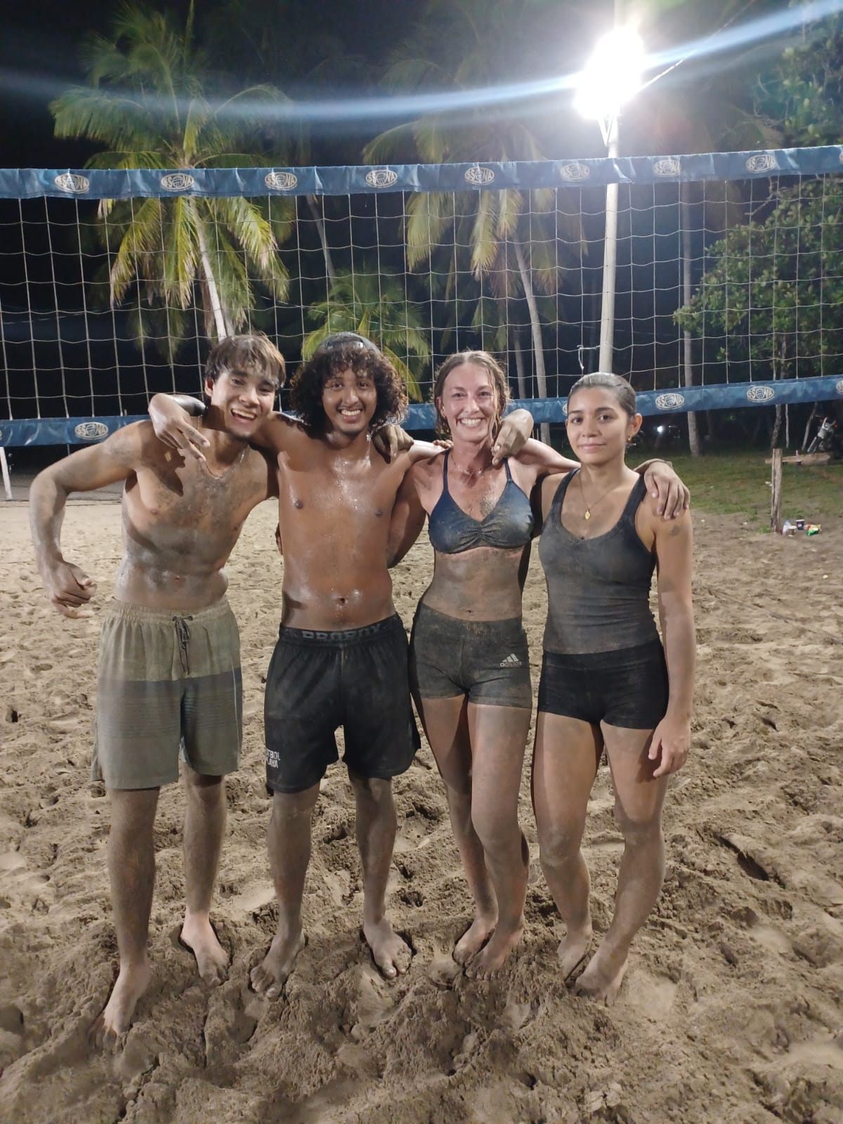 The finalists — sand everywhere, smiles even bigger.
