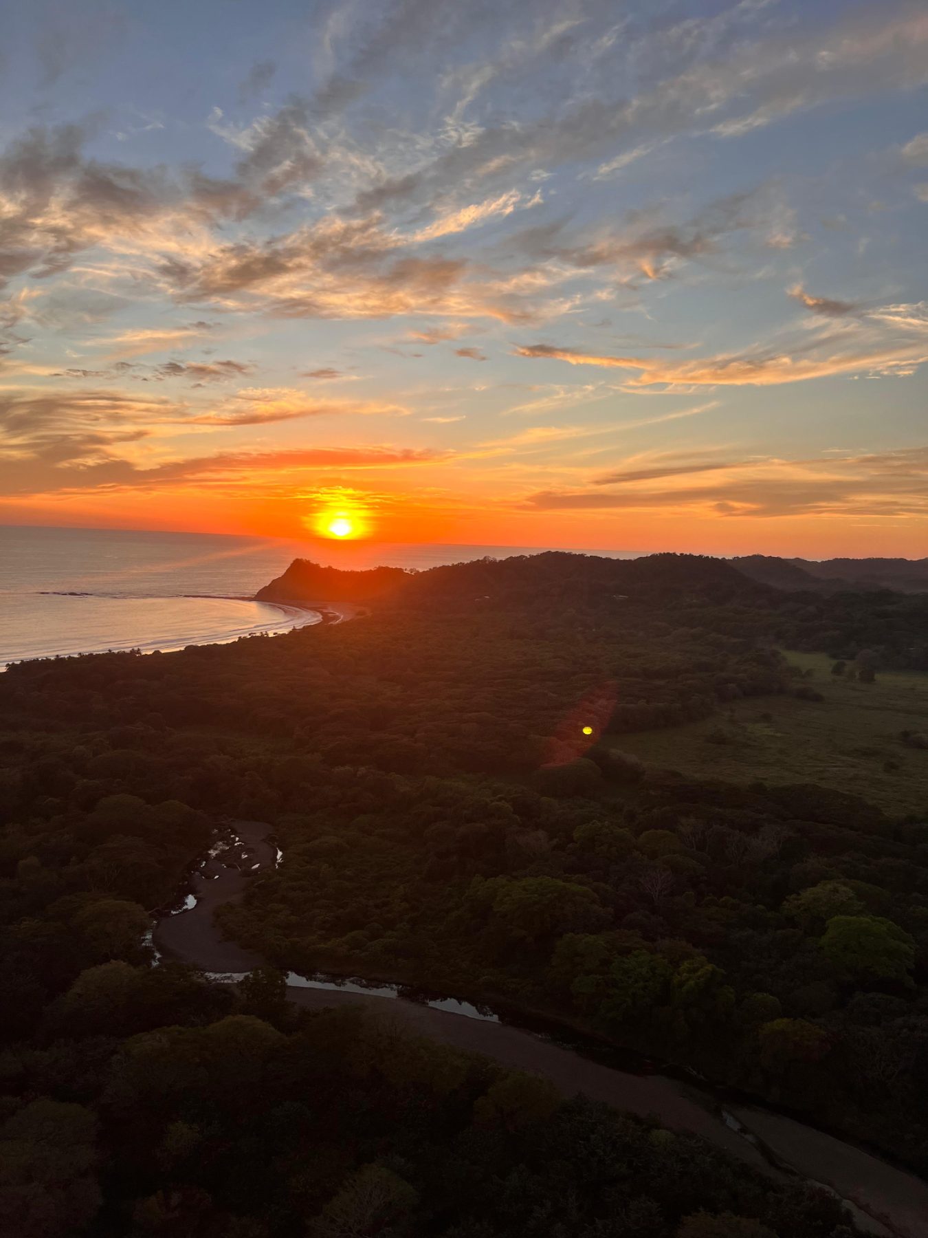 Aerial sunset over the Sámara coastline